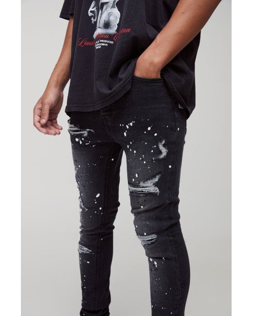 BoohooMAN Black Super Skinny Rip & Repair Paint Splatter Denim Jeans for men