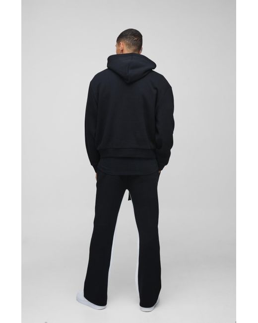 BoohooMAN Kastiger Oversize Trainingsanzug mit M Stern Print und Kapuze in Blue für Herren