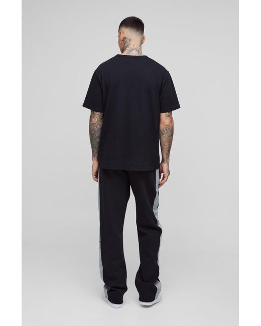 BoohooMAN Tall lockere Jogginghose mit Streifen-Detail in Black für Herren