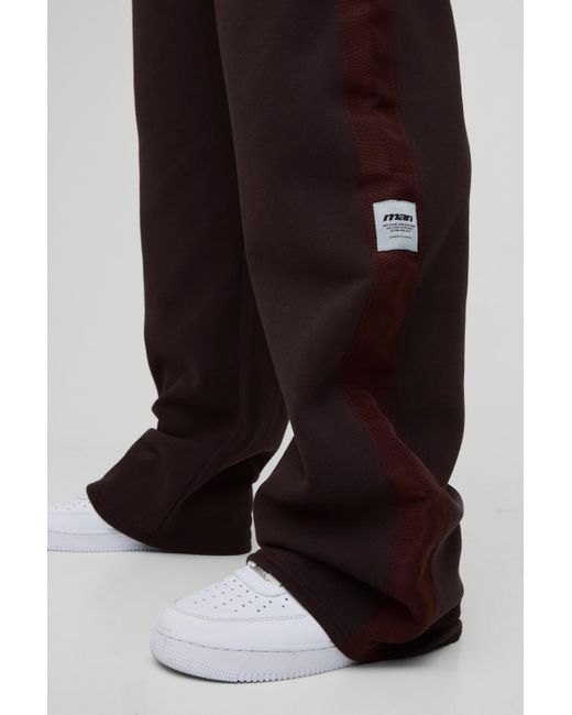 BoohooMAN Plus lockere Jogginghose mit Streifen-Detail in Black für Herren