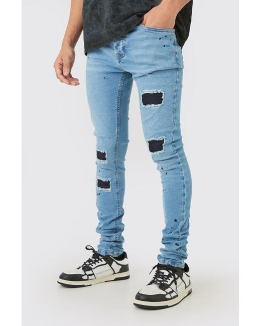BoohooMAN Super Skinny Stretched Stacked Rip & Repair Jean In Light Blue for men