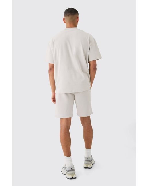 BoohooMAN White Oversized Extended Neck Official Embossed T-shirt & Short Set for men