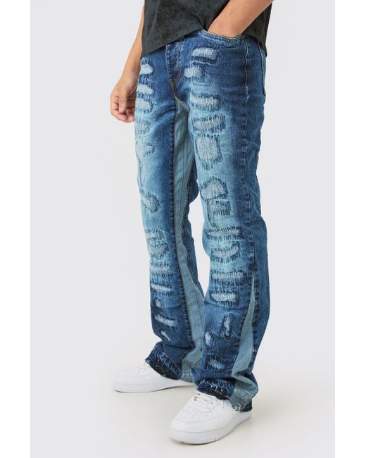 Boohoo Blue Slim Flare Rigid All Over Rip & Repaired Jeans In Indigo