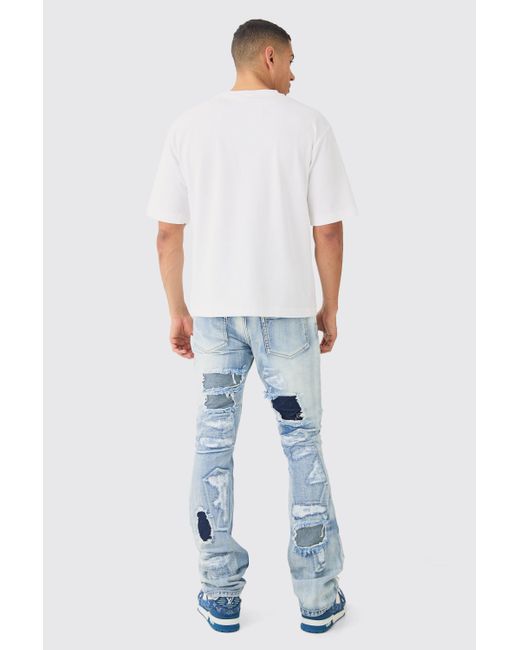 BoohooMAN Slim Rigid Flare Stacked Rip & Repair Jeans In Ice Blue für Herren