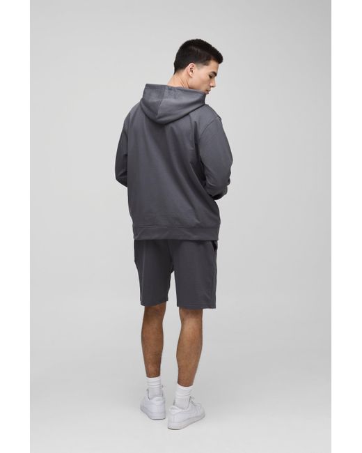 BoohooMAN Lockere mittellange Basic Shorts in Blue für Herren
