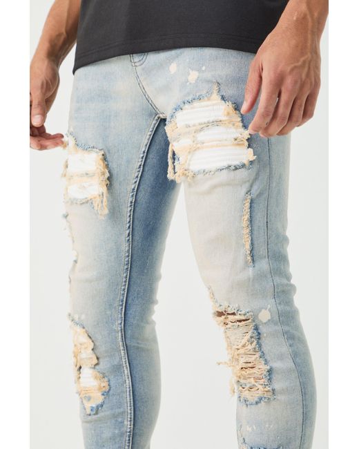 BoohooMAN Blue Skinny Stretch Stacked White Pu Biker Rip & Repair Jeans In for men