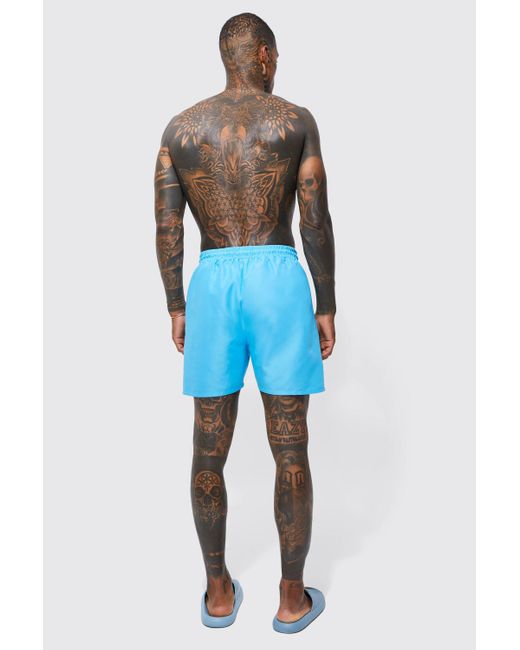 Boohoo Blue Man Signature Mid Length Swim Shorts for men