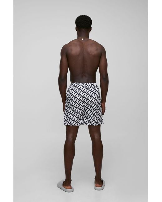 BoohooMAN Black Abstract Pattern Printed Mid Length Swim Trunks for men