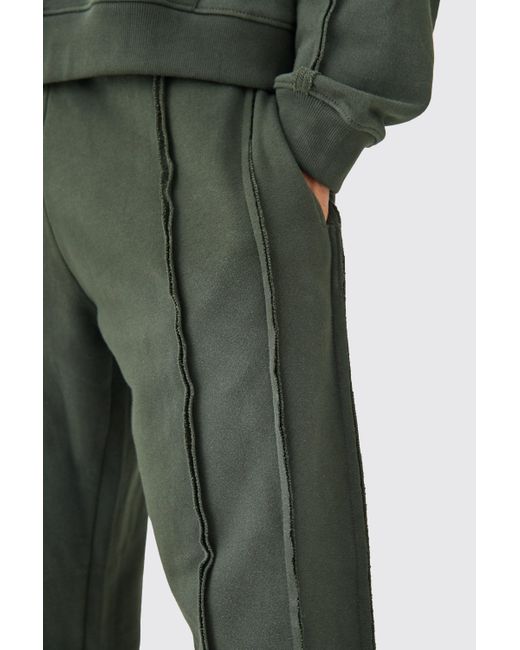 BoohooMAN Green Relaxed Raw Seam Spray Wash Joggers for men