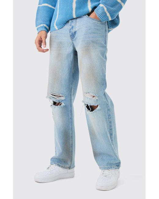 BoohooMAN Baggy Rigid Ripped Knee Dirty Wash Jeans In Light Blue for men