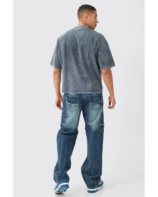 BoohooMAN Baggy Distressed Panelled Cargo Jeans In Mid Blue for men