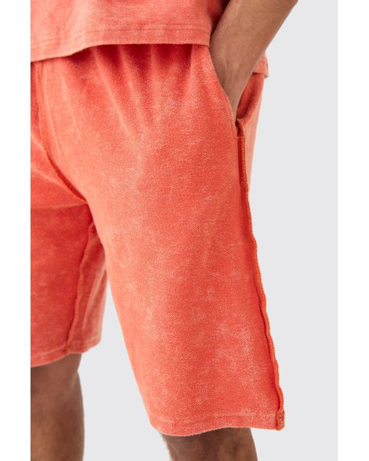 BoohooMAN Orange Loose Fit Reverse Loopback Printed Shorts for men