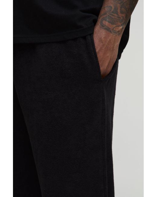BoohooMAN Plus lockere Premium Frottee-Jogginghose in Black für Herren