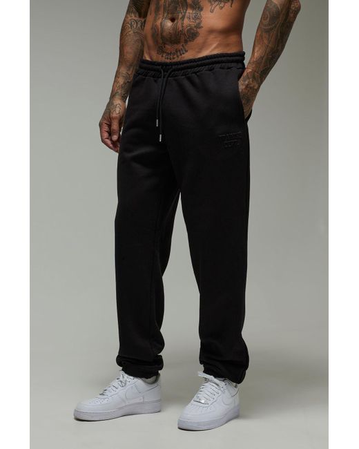 Pantalón Deportivo Tall Man Active Oversize Con Estampado Training Dept Boohoo de color Black