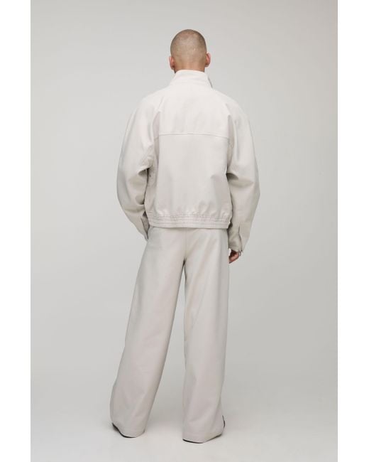 BoohooMAN Men's Natural Regular Fit Embroidered Funnel Neck Track Jacket casual jackets