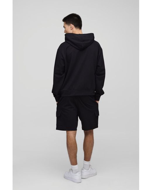 BoohooMAN Lockere mittellange Cargo-Shorts in Black für Herren