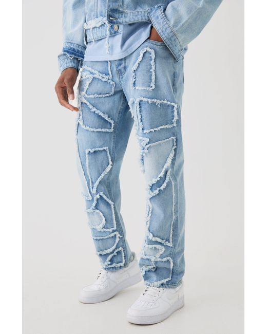 BoohooMAN Distressed Patchwork Relaxed Rigid Jeans In Light Blue for men