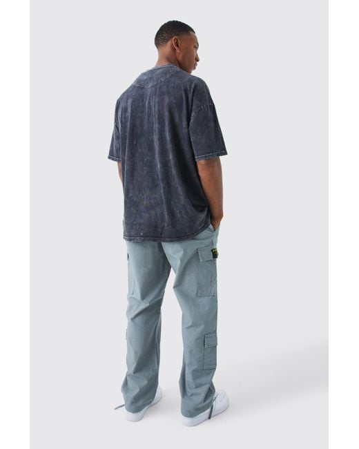 Pantalón Cargo Holgado Con Costuras Antidesgarros Y Etiqueta De Tela Boohoo de color Blue