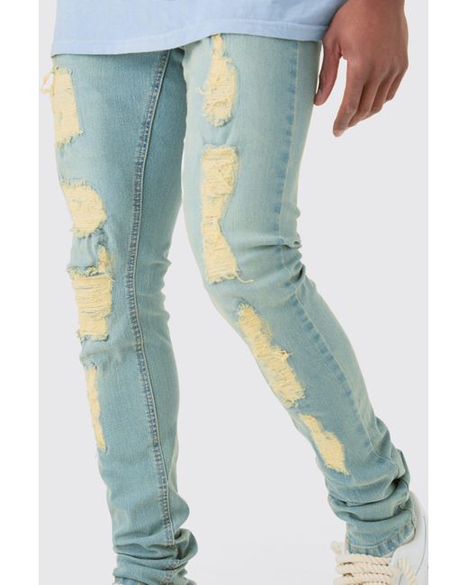 BoohooMAN Skinny Stacked Distressed Ripped Jeans In Antique Blue for men