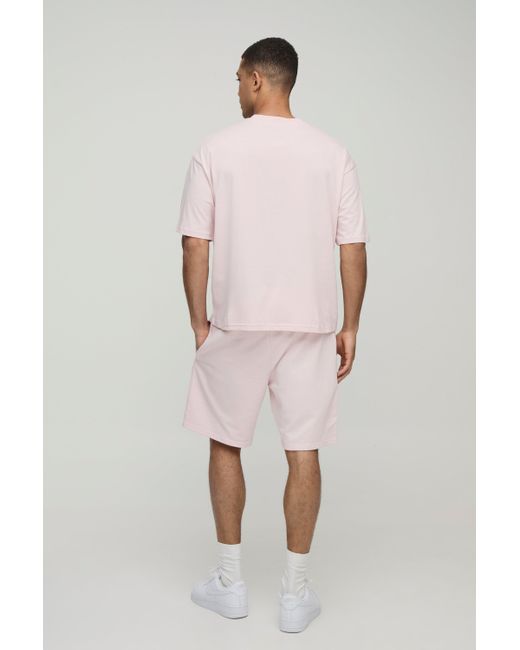 BoohooMAN Lockere mittellange Basic Shorts in Pink für Herren