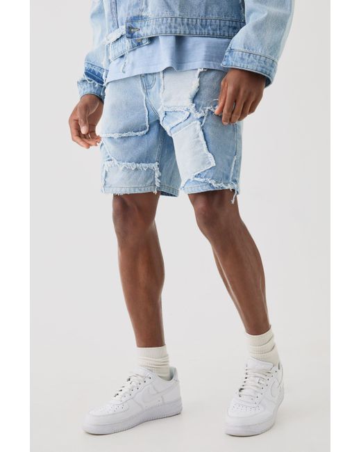 BoohooMAN Distressed Patchwork Relaxed Denim Short In Light Blue for men