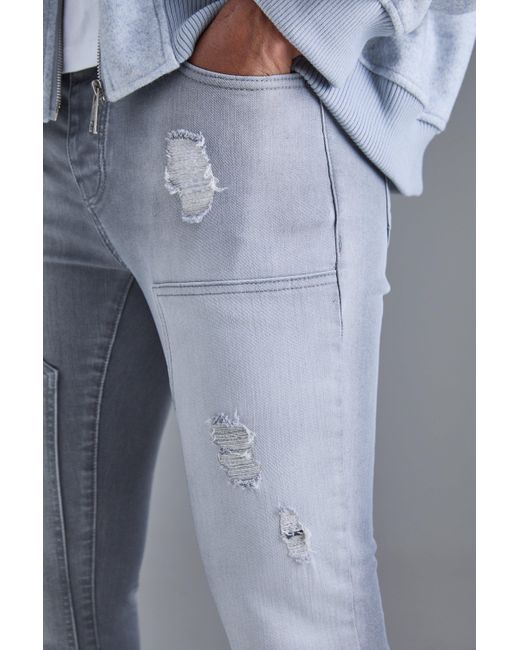 BoohooMAN Blue Skinny Stretch Stacked Ripped Carpenter Zip Hem Jeans In Grey for men