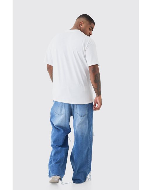 BoohooMAN Blue Plus Relaxed Rigid Flare Rip & Repair Applique Jeans for men