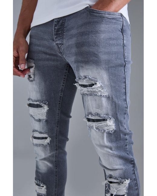 Skinny Stacked Distressed Ripped Jeans In Grey Boohoo de color Blue