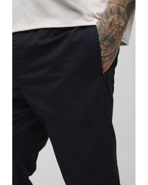 BoohooMAN Tall Schlaghose mit elastischem Bund in Black für Herren