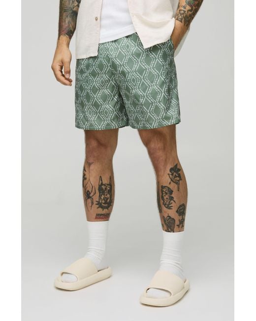 BoohooMAN Green Abstract Pattern Mid Length Swim Trunks for men