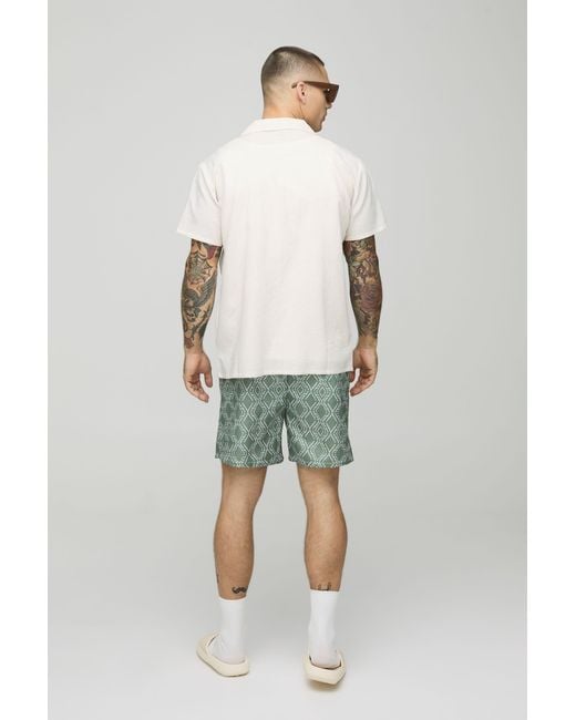 BoohooMAN Green Abstract Pattern Mid Length Swim Trunks for men