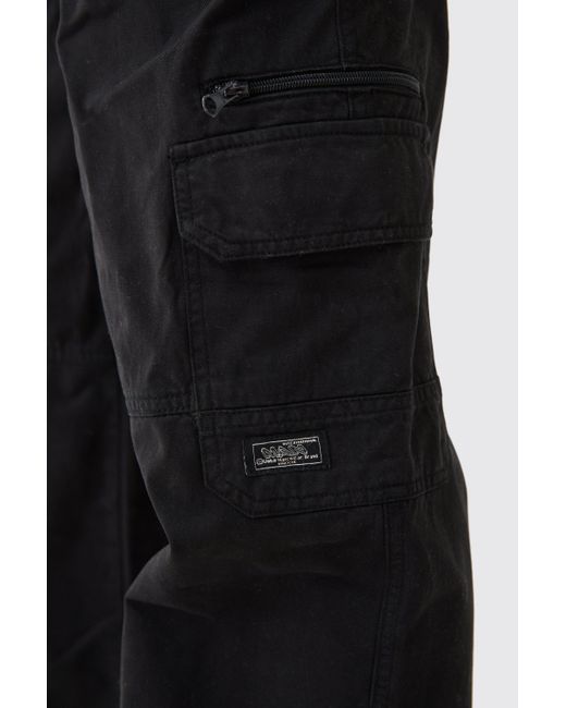BoohooMAN Black Fixed Waist Cargo Zip Pants With Woven Tab for men