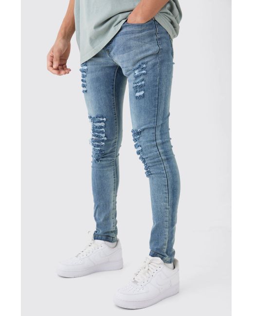 Boohoo Blue Super Skinny Jeans With All Over Rips