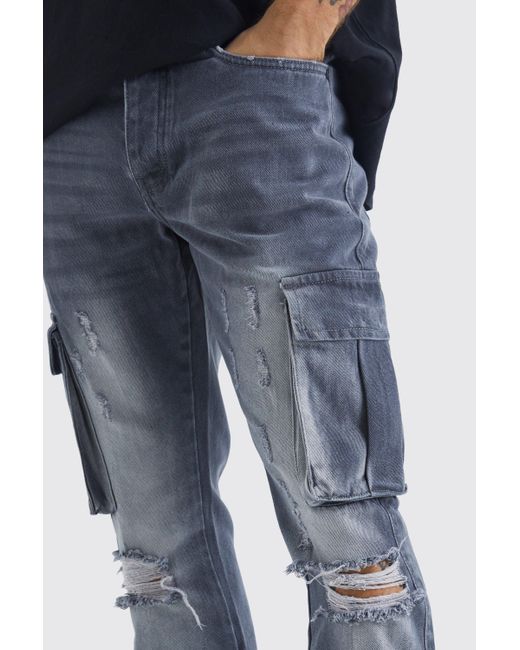 BoohooMAN Slim Flare Rigid Ripped Cargo Pocket Jean in Blue for Men ...