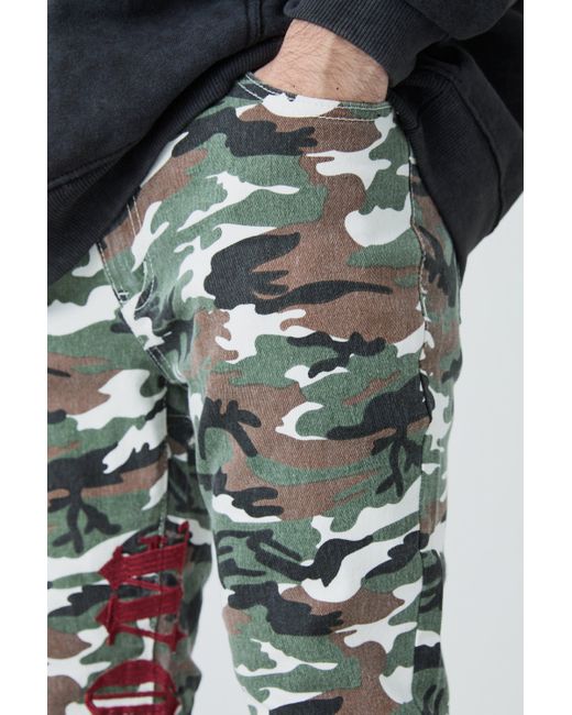 BoohooMAN Skinny Stretch Stacked Camo Embroidered Gusset Jeans in Black für Herren