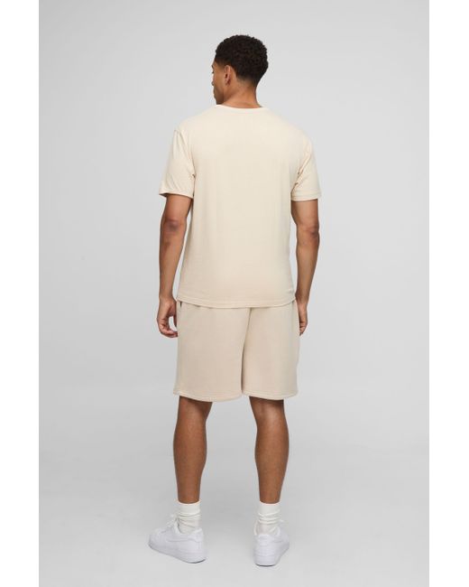 BoohooMAN Natural Oversized Worldwide Embossed Drop Crotch Shorts for men