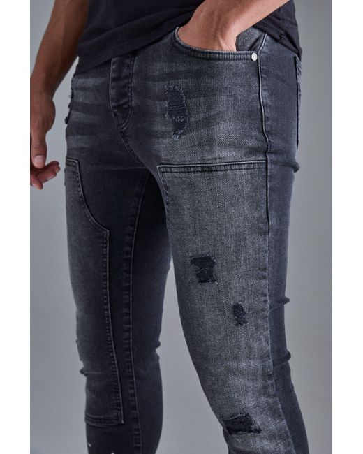 BoohooMAN Blue Skinny Stretch Stacked Ripped Carpenter Zip Hem Jeans In Black for men