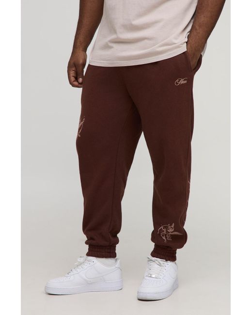 BoohooMAN Brown Plus Regular Fit Cherub Worldwide Print Jogger for men