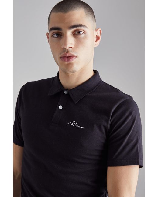 BoohooMAN Slim-Fit Poloshirt mit Man-Stickerei in Black für Herren