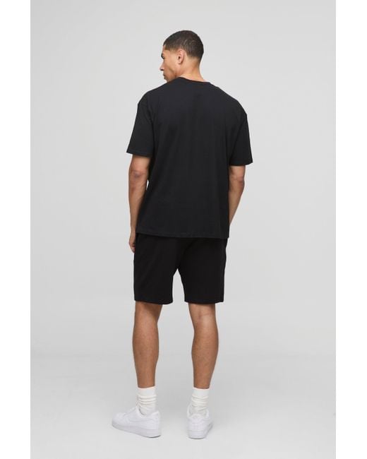 BoohooMAN Schwarzes Oversize T-Shirt mit MAN Sunset Print in Black für Herren