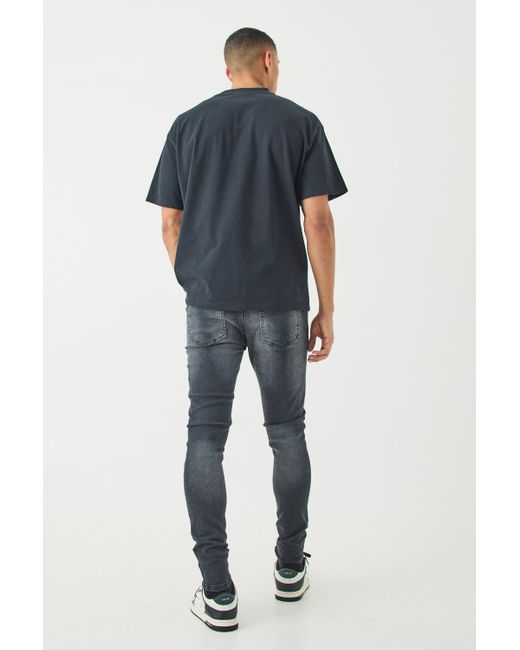 BoohooMAN Skinny Stretch All Over Ripped Black Jeans in Blue für Herren