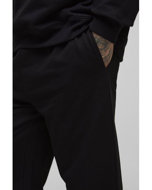 BoohooMAN Tall lockere Basic Jogginghose in Black für Herren