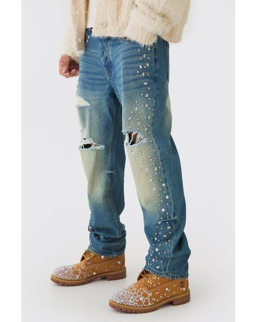 BoohooMAN Relaxed Rigid Flared Embellished Ripped Jeans in Blue
