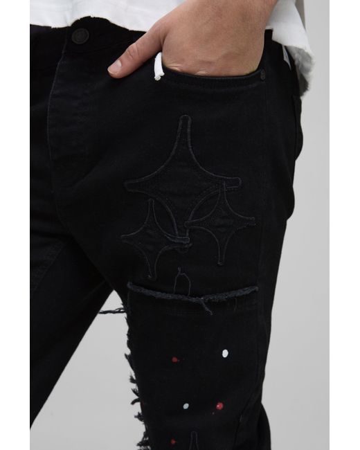 Vaqueros Pitillo Con Salpicadura De Pintura Y Apliques De Estrellas Estilo Carpintero Boohoo de color Black