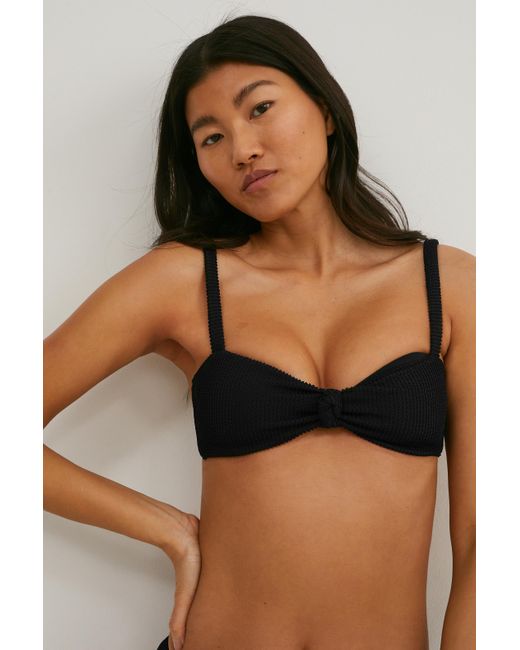 Top de bikini-bandeau-con relleno-LYCRA® XTRA LIFETM C&A de color Negro |  Lyst