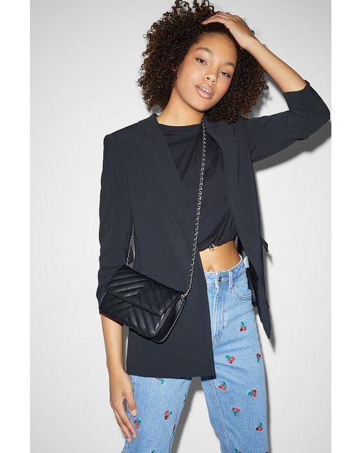 C A bolso bandolera peque o polipiel CLOCKHOUSE de color Negro Lyst