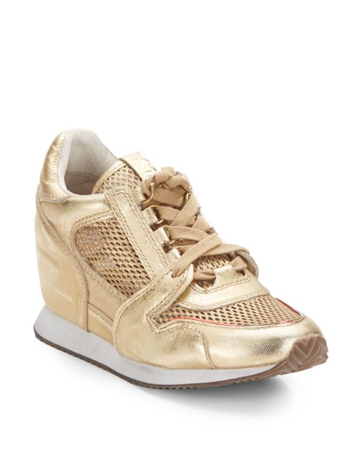 Buy White Leather Sneaker Wedges by Tiesta Online at Aza Fashions.