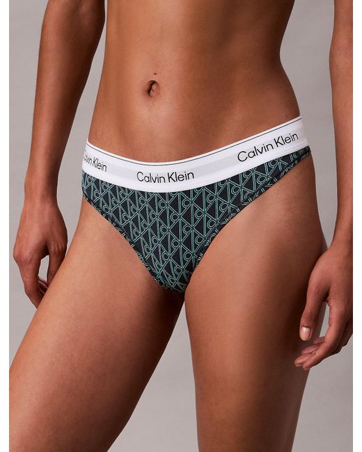 String Calvin Klein en coloris Green