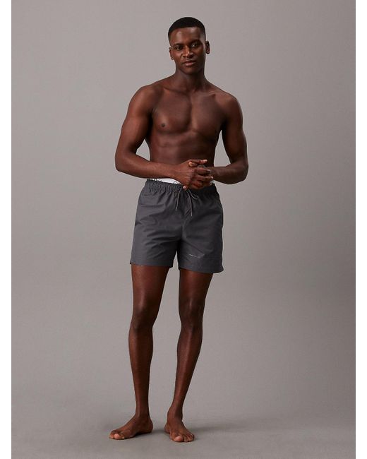 Short de bain court avec double ceinture Calvin Klein pour homme en coloris Brown