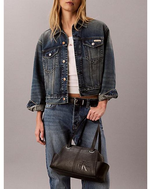 Calvin Klein Black Embossed Monologo Shoulder Bag